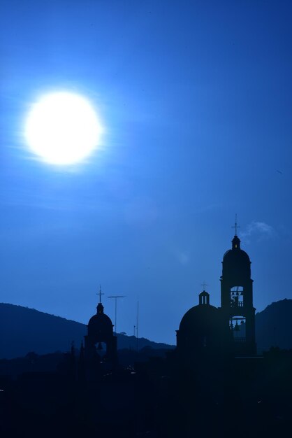 Silhouette cathedral against sky during sunset