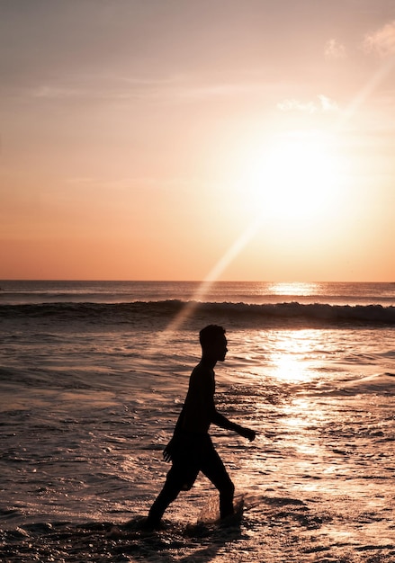 Silhouette of children on Beautiful view of the sky at sunset on the beach