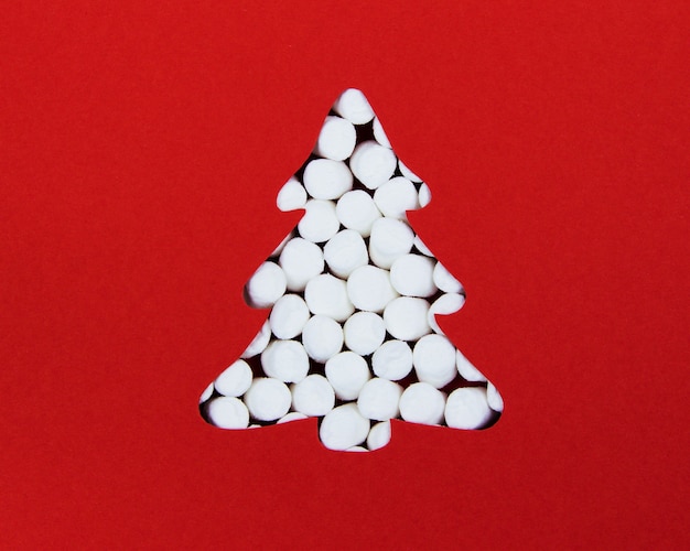 Silhouette of a Christmas tree out of marshmallows the view from the top Creative Christmas arrangement