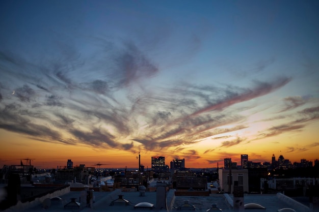 silhouette of cityscape of buildings against sky