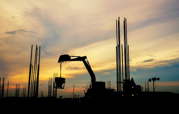 silhouette construction worker Concrete pouring during commercial concreting floors 