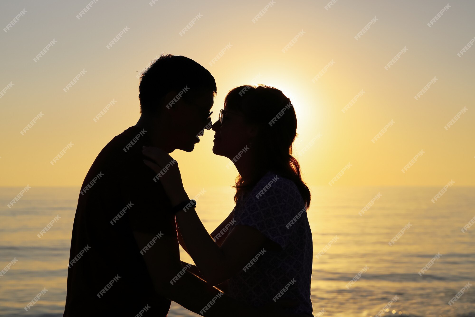 Couple in love, profile silhouettes close to each other, beautiful