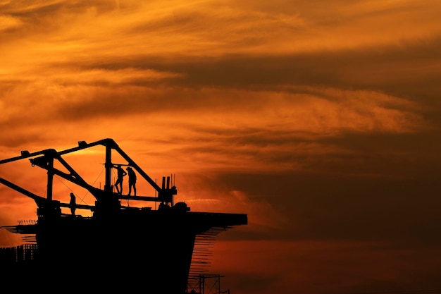 Silhouette of crane at sunset