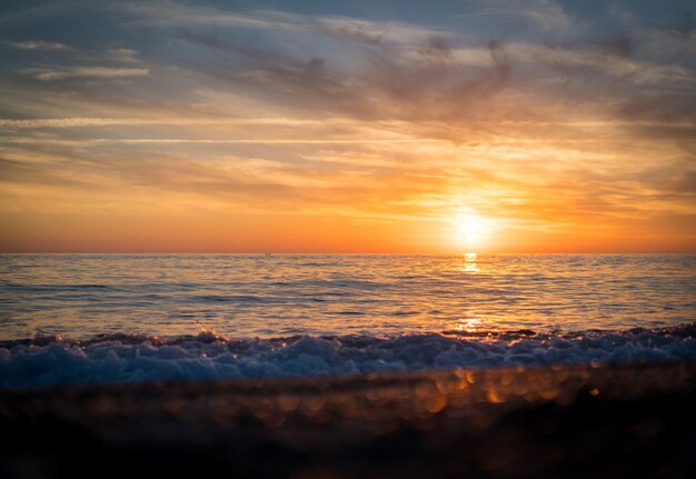 Silhouette of empty beach at sun set