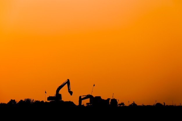 Silhouette of excavator loader at construction site,Silhouette Backhoe