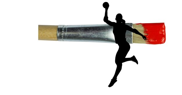 Photo silhouette of female handball player against paint brush with red painted tip on white background