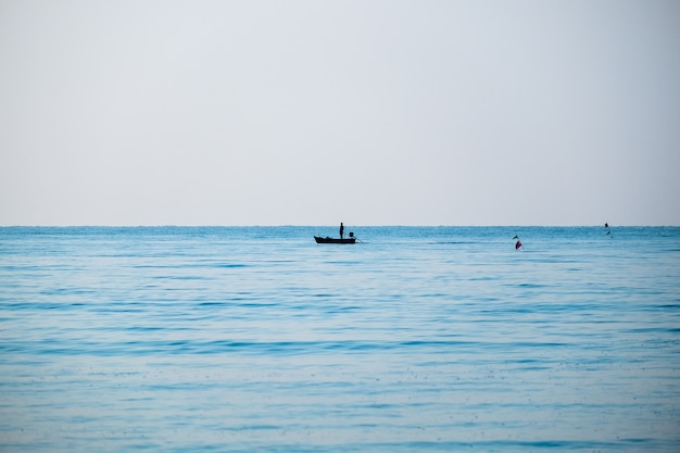 Silhouette fisherman fishing blue sea beautiful