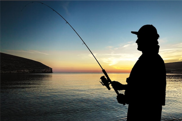 Silhouette of fishing man