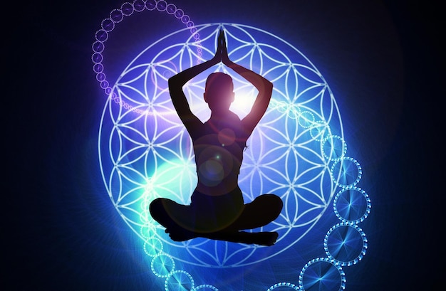 Silhouette of a girl in Lotus position on the background of the fractal universe