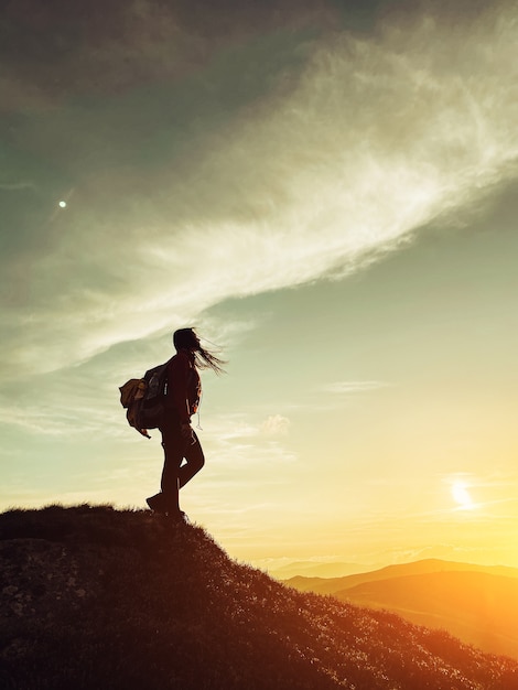 Silhouette of a girl in the mountains