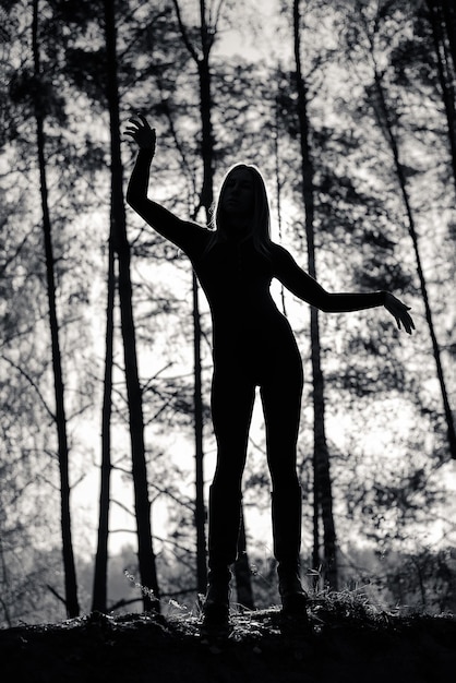 Silhouette of a Girl with a beautiful body in the Forest