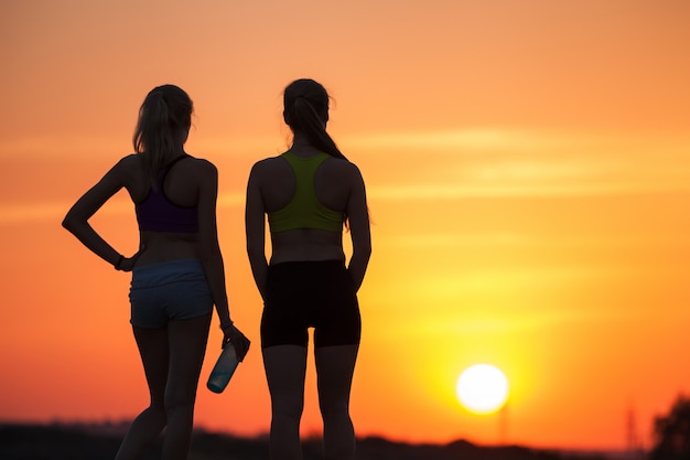 silhouette of girls at sunset