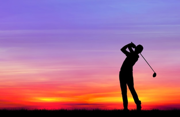 silhouette golfer playing golf during beautiful sunset