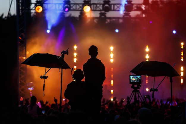 Silhouette group of cameramen at an event