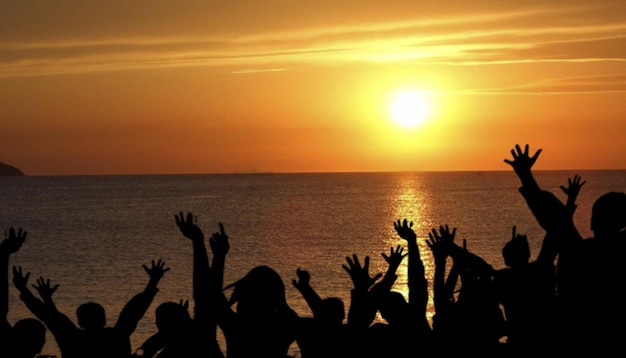 Silhouette hands people at sunset celebration concept