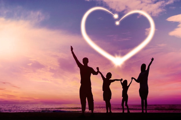 Photo silhouette of happy family with heart symbol