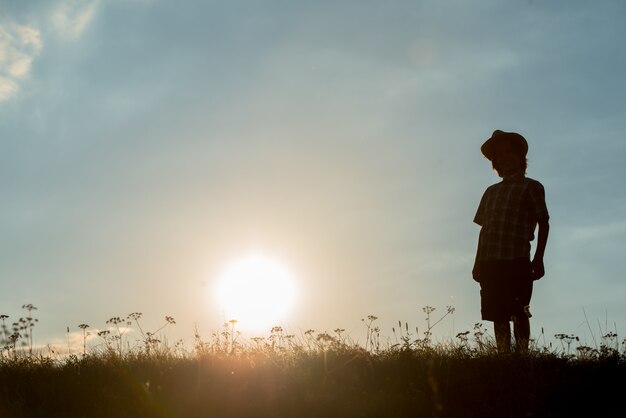 silhouette of happy guy enjoying himself