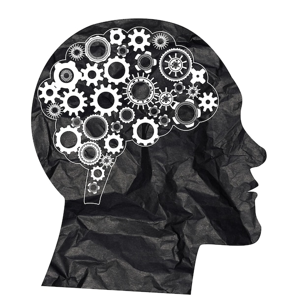 Photo silhouette of a head and a brain consisting of cogs concept of searching for ideas mental health