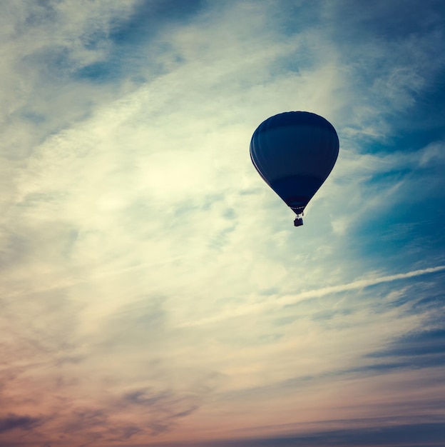 Silhouette of hot air balloon at sunset