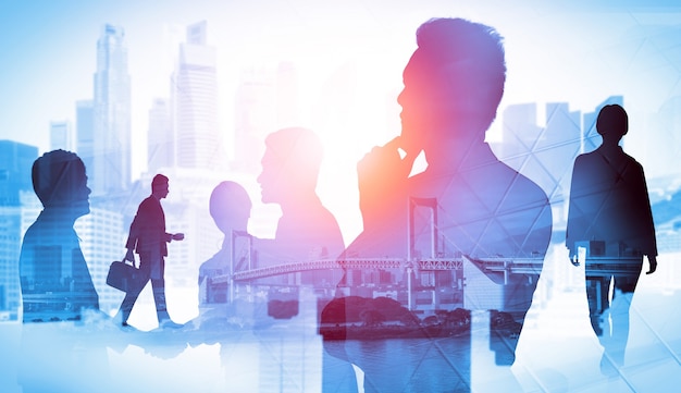 Silhouette image of business people group on city background