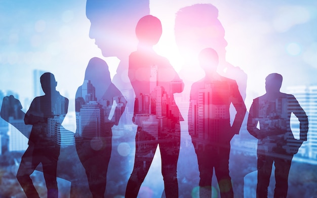 Silhouette image of business people group on city background