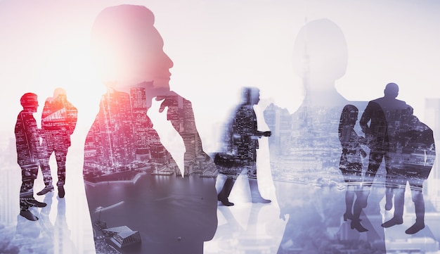 Silhouette image of business people group on city background