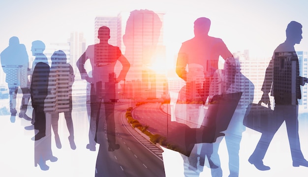 Silhouette image of business people group on city background