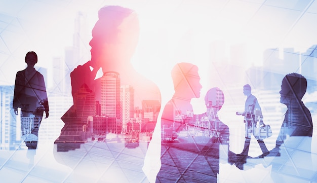 Silhouette image of business people group on city background