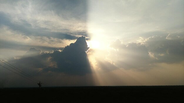 Silhouette landscape against sky during sunset