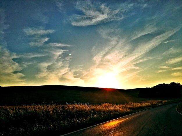 Silhouette of landscape against sunset sky