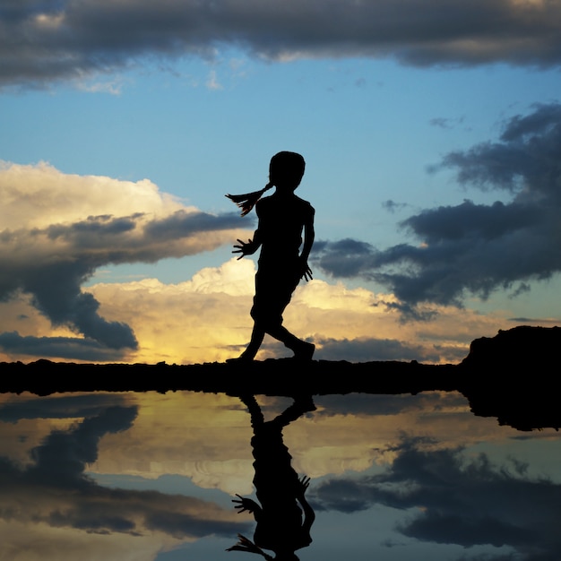 Silhouette of a little girl jumping