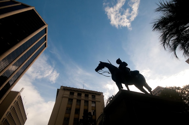 Silhouette of majestic horse soldier knight in the city centre