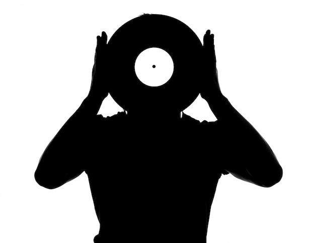 Silhouette of the male dj with vinyl record isolated.