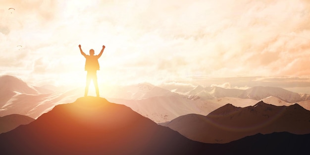 Silhouette of male on the mountain Leadership Concept