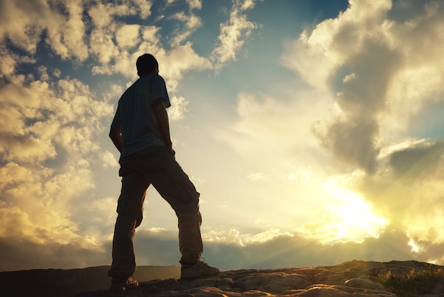 Silhouette of man in mountain. Conceptual scene.