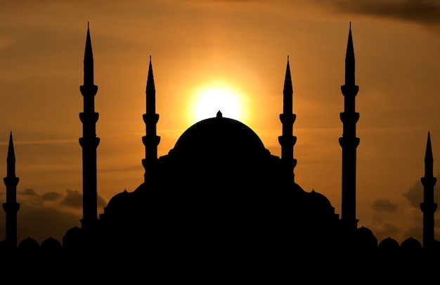 silhouette of mosque when sun goes down