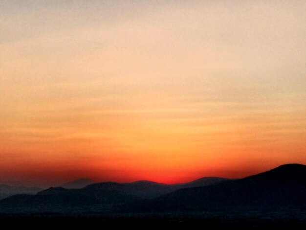 Silhouette of mountain against sky during sunset