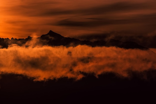 Silhouette of mountains and red sky during beautiful sunset Peak Krivan and High Tatras