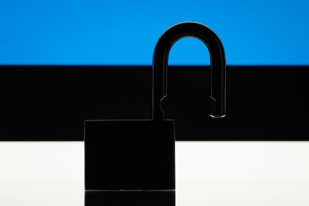 Silhouette of open lock on background of flag of Estonia