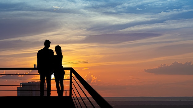 Silhouette of people on a panorama background