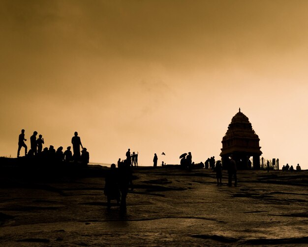 Silhouette of people at park during sunset