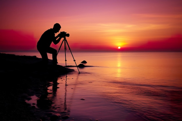 Photo silhouette of photographer on camera