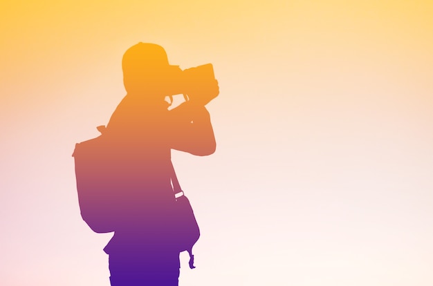 Silhouette of photographer and his equipment