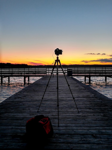 Photo silhouette of photographing against sky during sunset