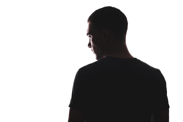 Photo silhouette portrait of man with his back looking away, isolated