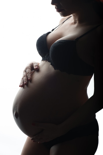 Silhouette of Pregnant woman on a white background