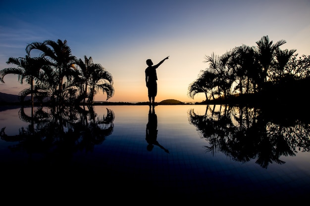 Silhouette pride man with twilight sky background