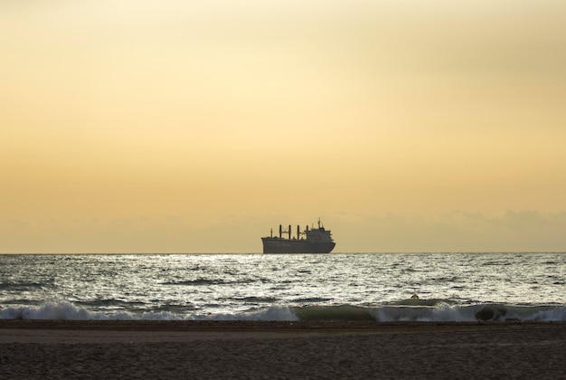 Silhouette of a ship at sunset