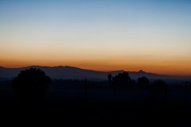 Silhouette shot of mountains at night