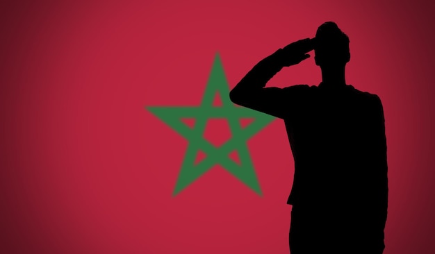 Foto silhouette di un soldato che saluta contro la bandiera del marocco